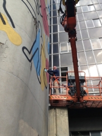 Consolidating the peeling paint on Keith Haring's deteriorated 1987 mural at the Hopital Necker des Enfants Malades in 